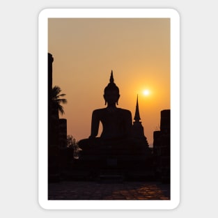 Buddha statue against sunset silhouette Sticker